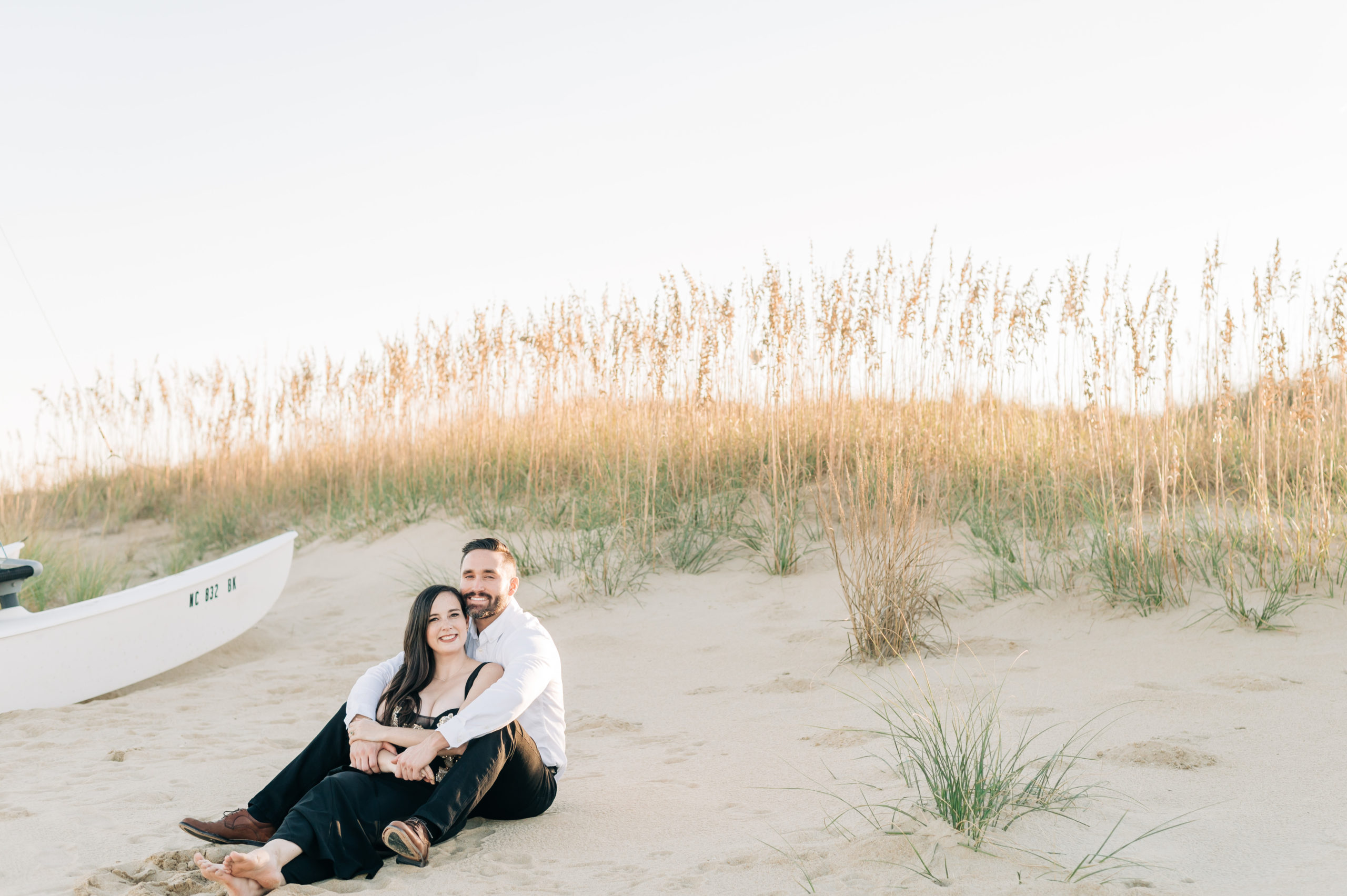 Couple snuggling during Virginia Beach Engagement Portraits
