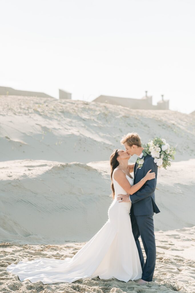 Bride and groom on beach in OBX