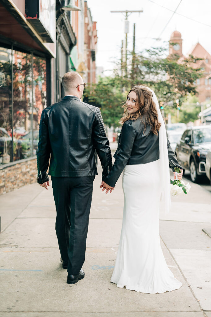 Bride and groom in leather jackets