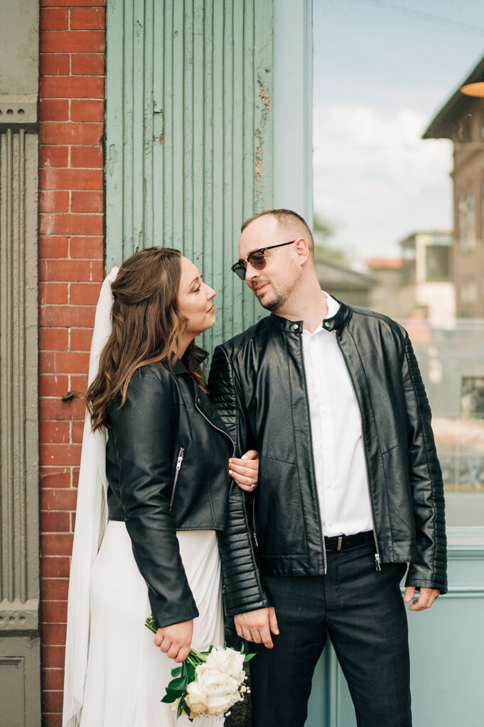 Bride and groom in leather jackets