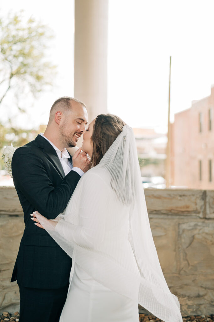 Bride and groom kissing at downtown richmond elopement