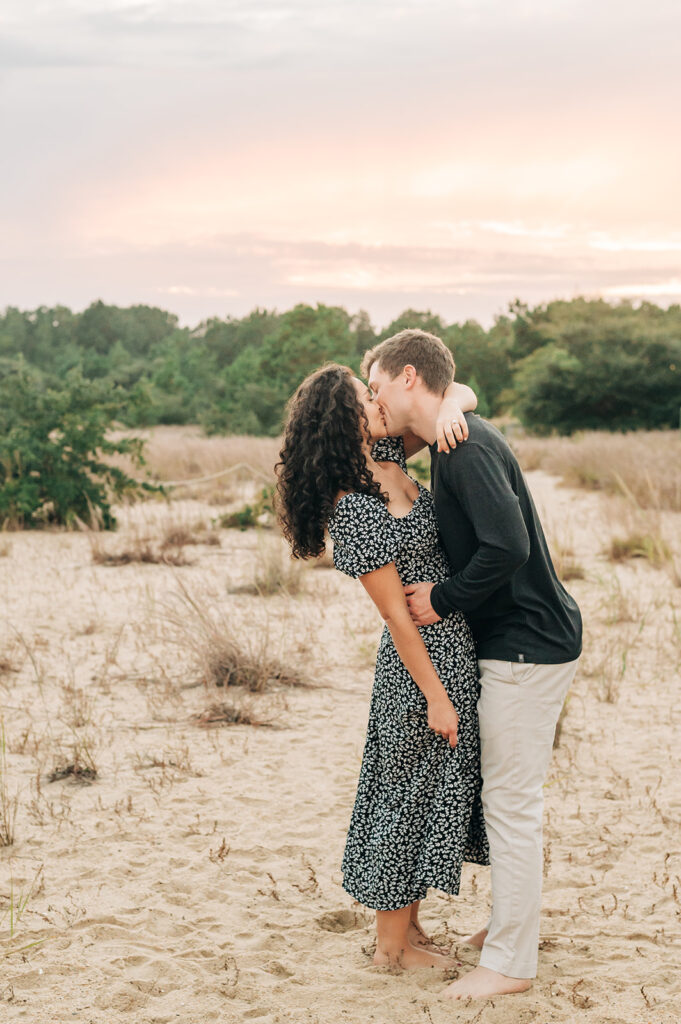 couple at sunset engagement photos at Pleasure House Point