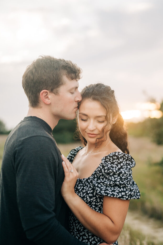 couple at sunset engagement photos at Pleasure House Point