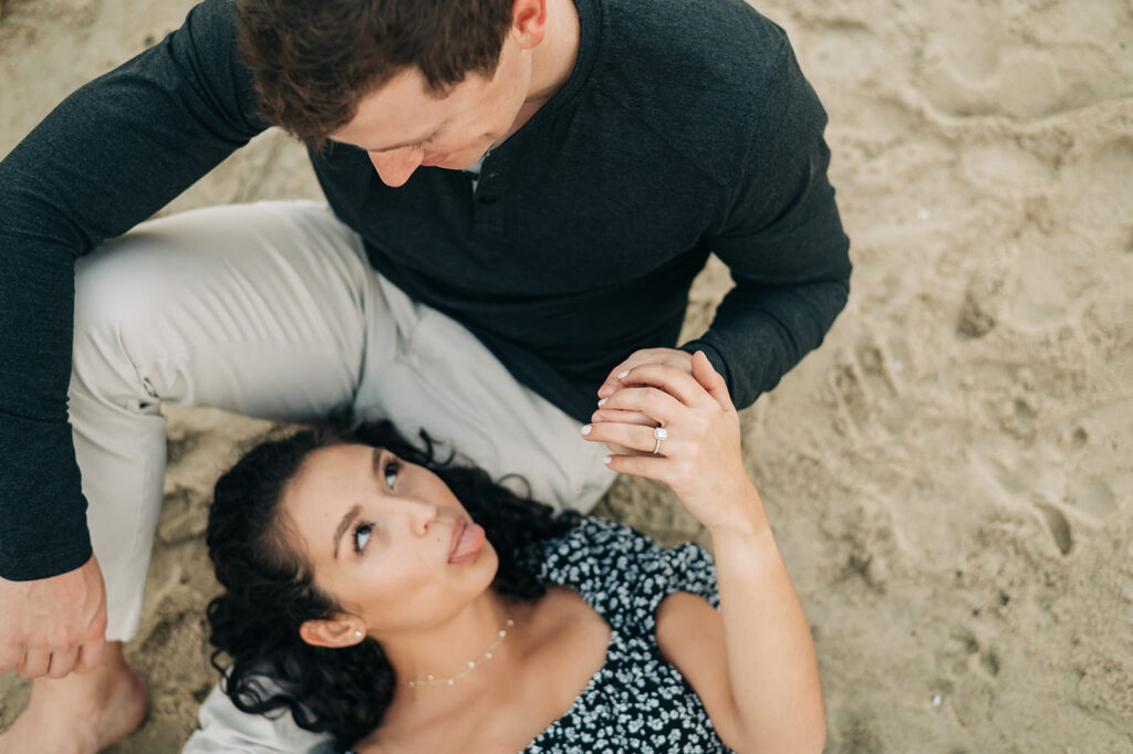 couple flirting during engagement photos