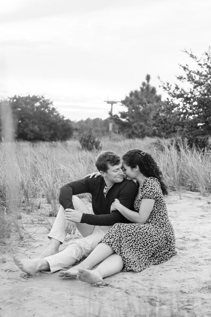 couple snuggling during Pleasure House Point engagement photos