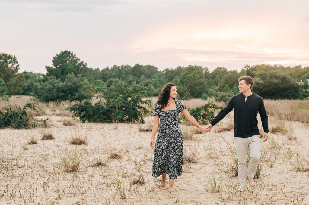 couple at sunset engagement photos at Pleasure House Point