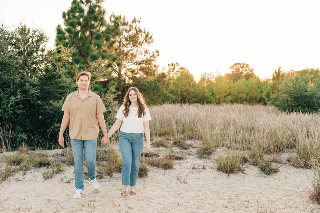 couple holding hands on the trail