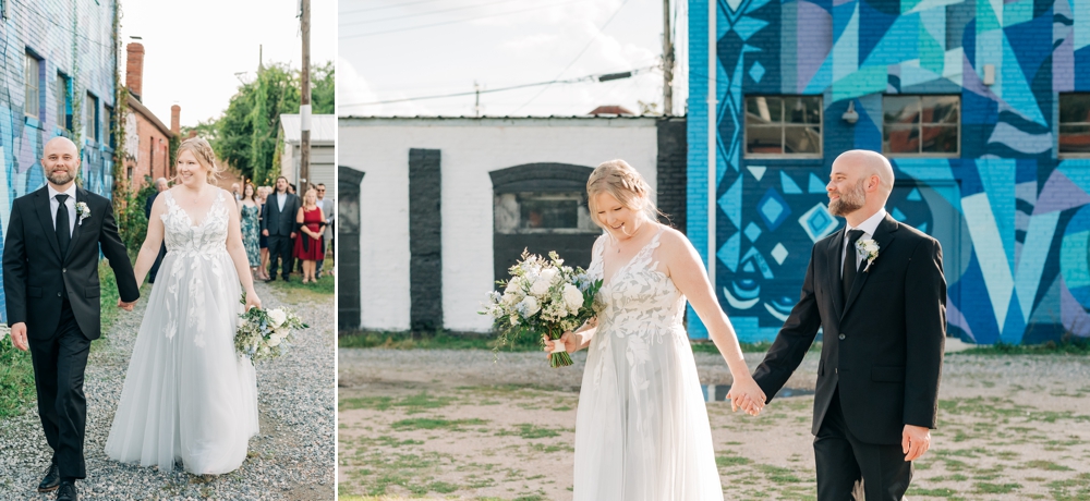 Bride and groom walking in front of murals after wedding