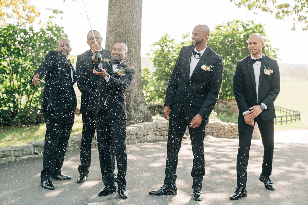 Groom and wedding party at fall wedding at The goodstone Inn