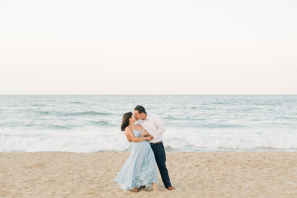 Couple spinning by the ocean in Virginia Beach