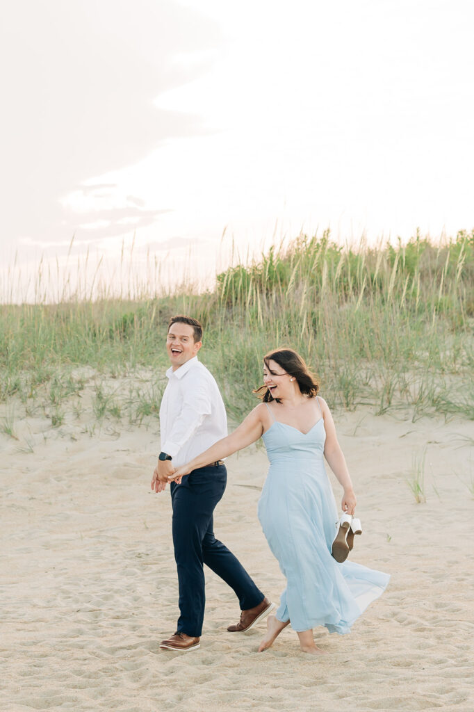 Couple dancing by the dunes in Virginia Beach