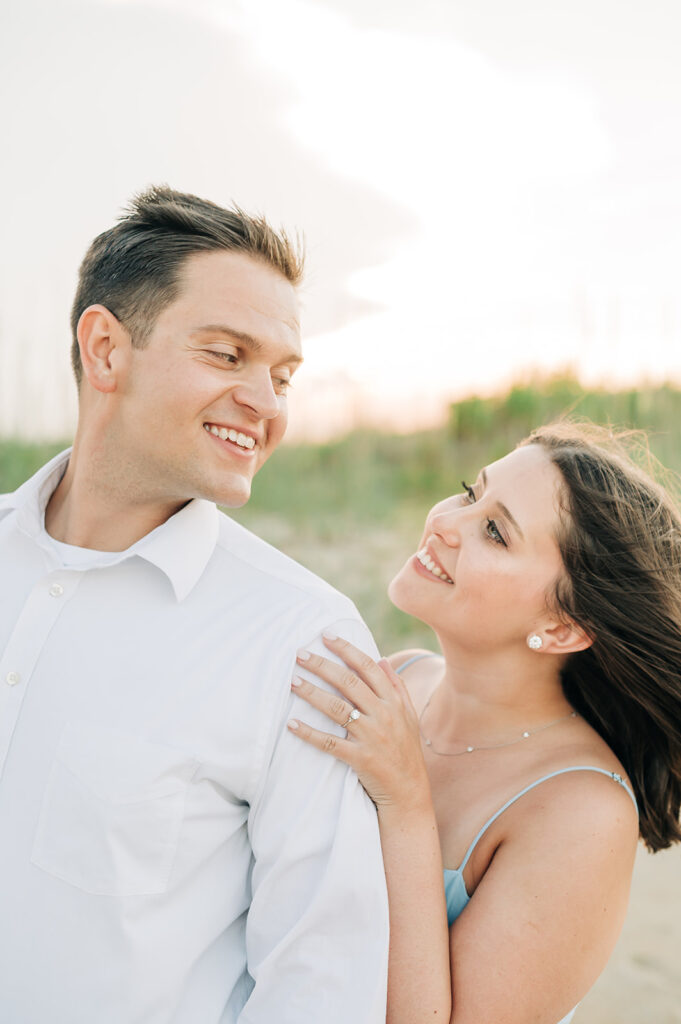 Couple embracing lovingly in Virginia Beach