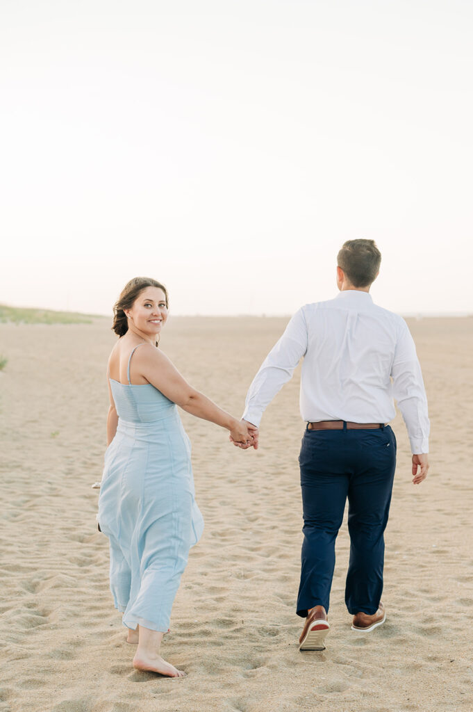 Couple holding hands in Virginia Beach