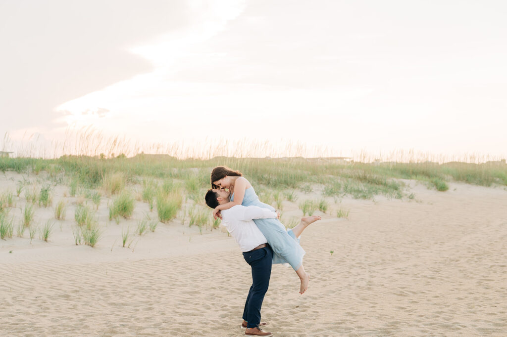 Couples picking up and embracing in Virginia Beach