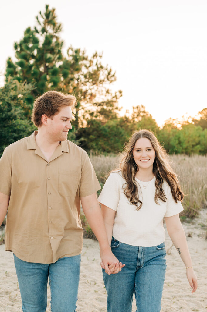 Couple walking through the trails holding hands