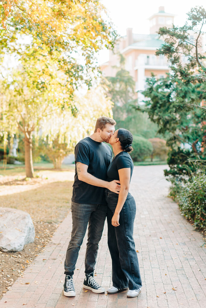 Couple kissing near pagoda in Norfolk