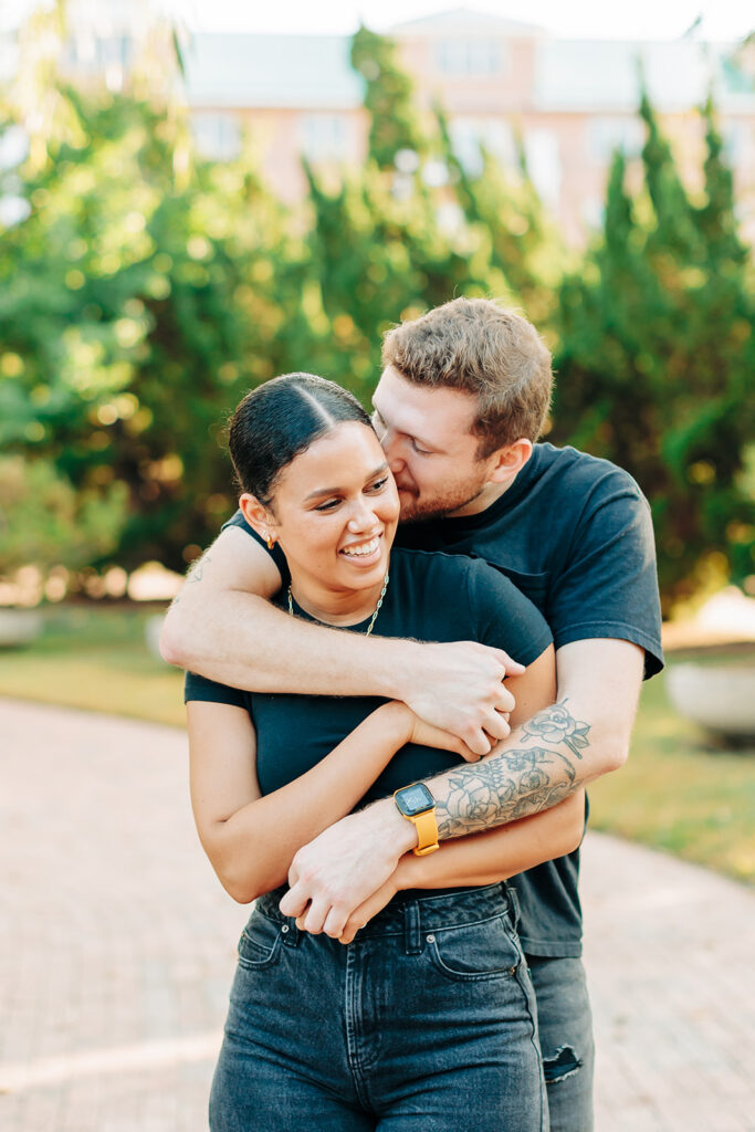 Couple cuddling in Norfolk 