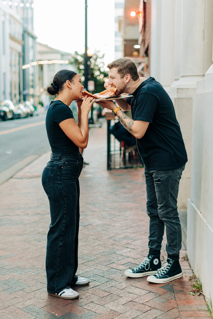 Couple having pizza in downtown Norfolk