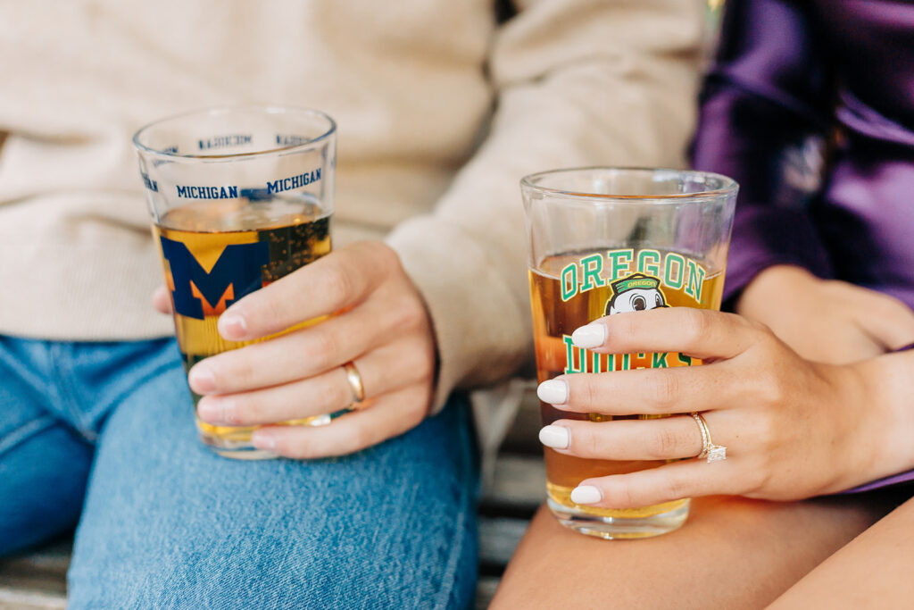 Couple drinking from pint glasses