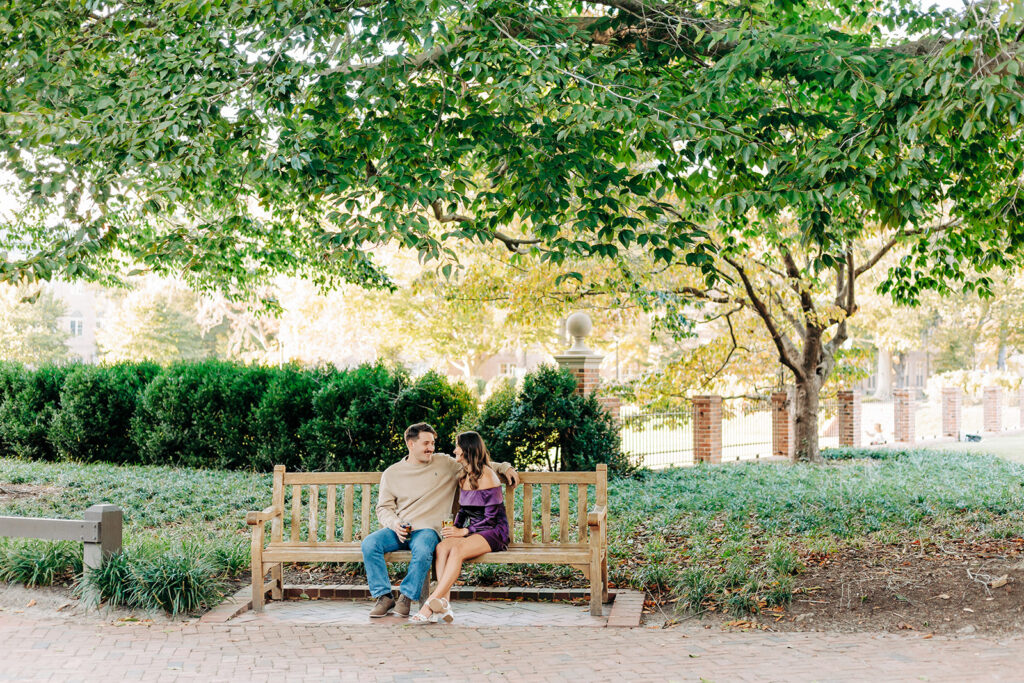 couple sitting on a bench at William and Mary 