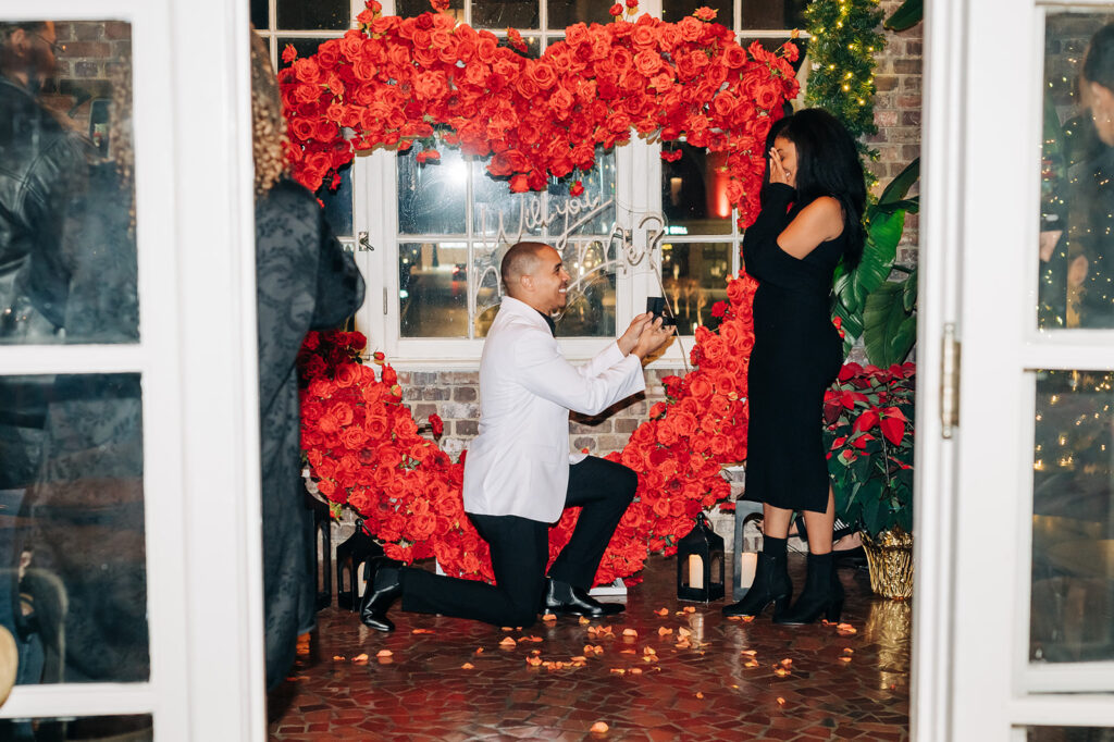 proposing at the cavalier in front of a rose heart