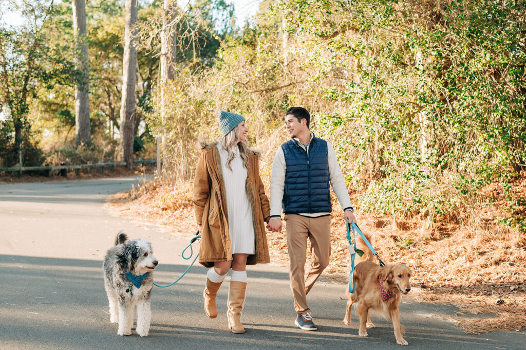 couple walking with dogs