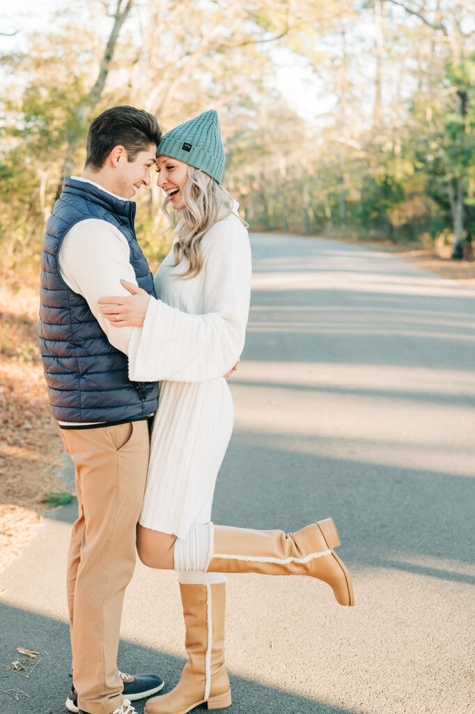 couple touching foreheads and laughing