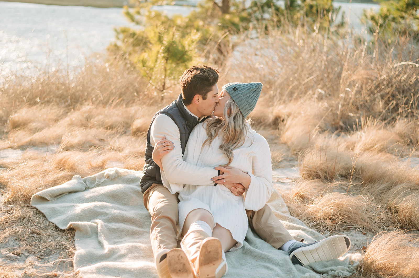 couple kissing on the beach in winter