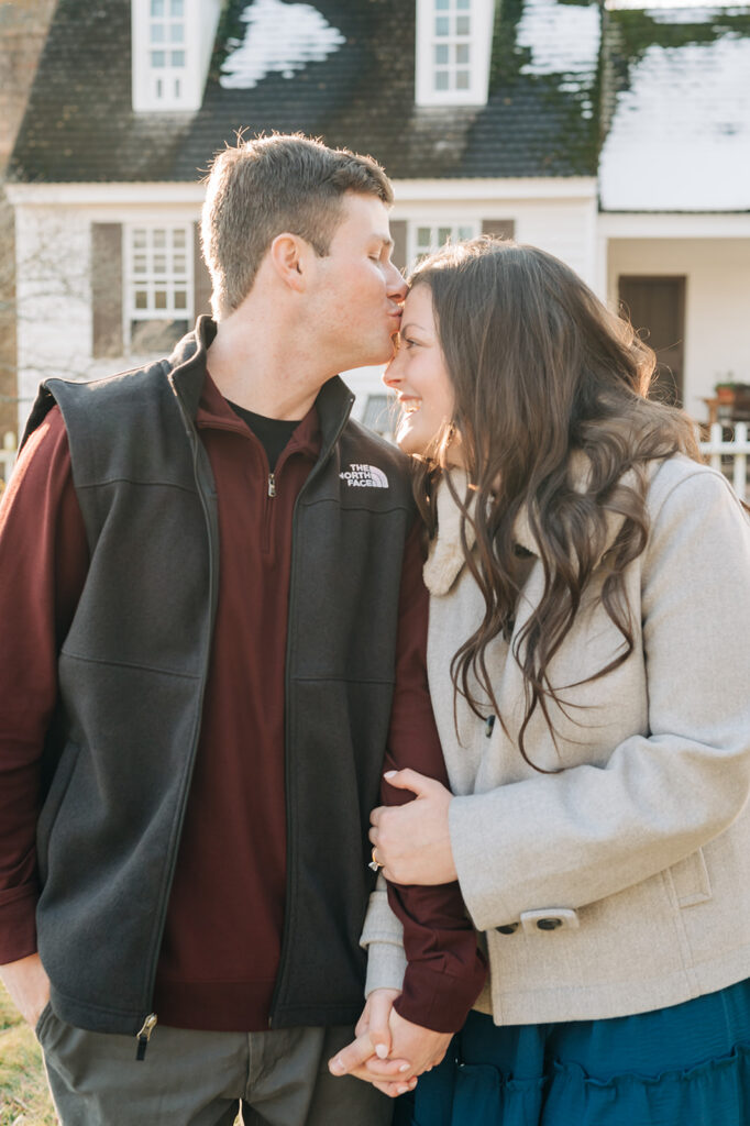 couple kissing forehead