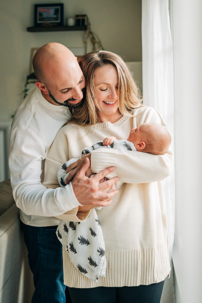 parents smile at baby