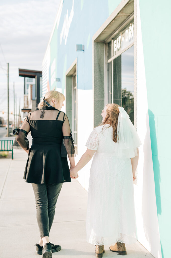 two women walking into brewery