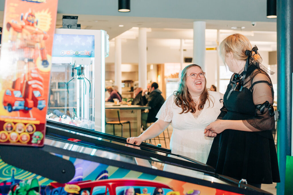 couple playing games at arcade