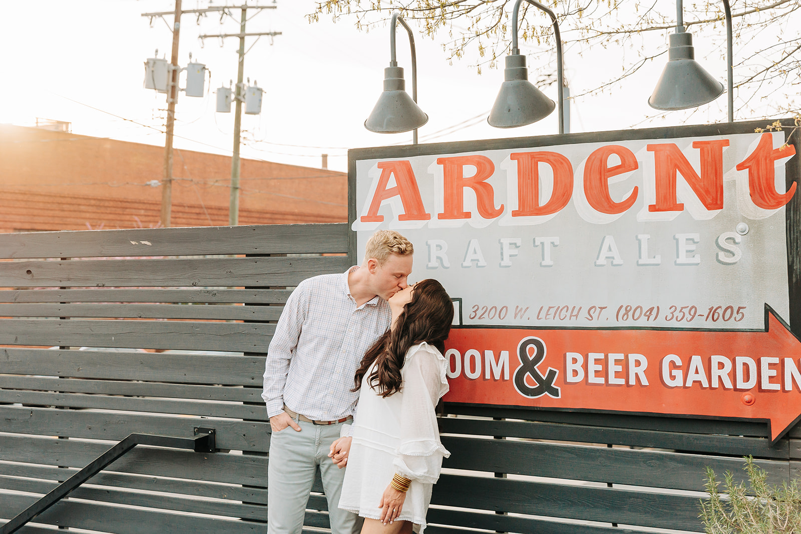 Couple kissing at Ardent Brewery