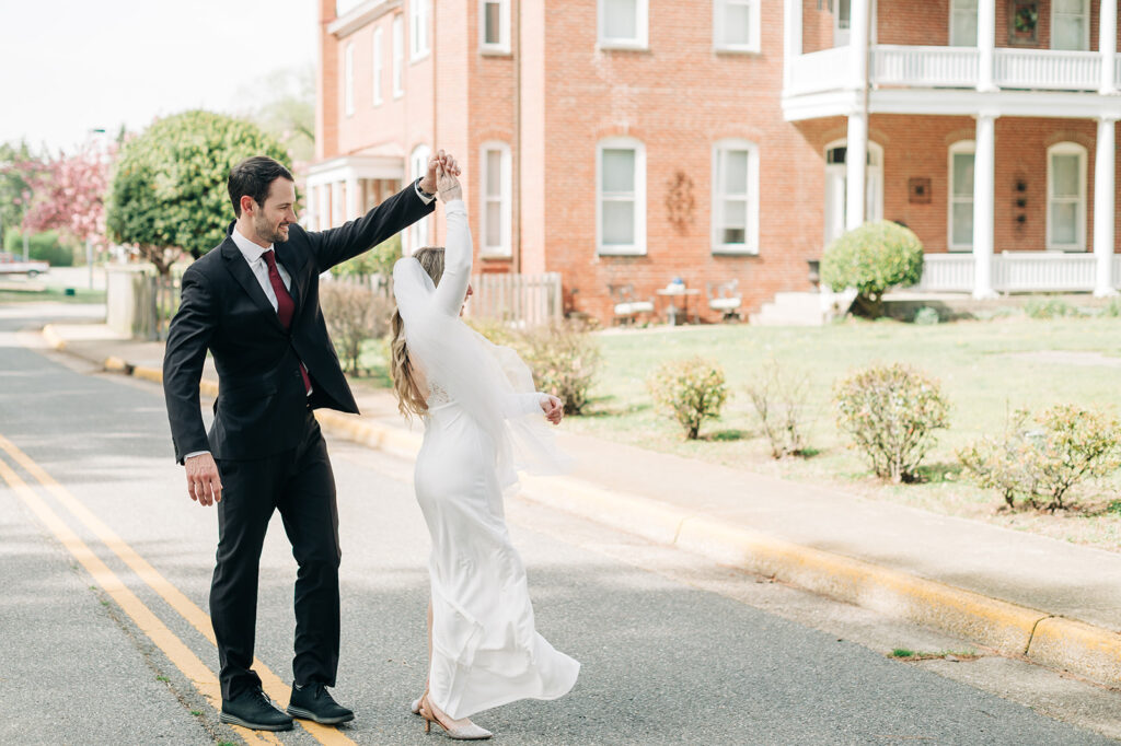 groom twirls bride