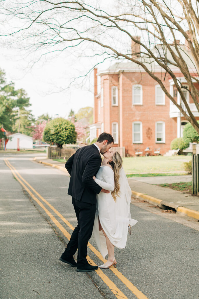 couple kisses on street line