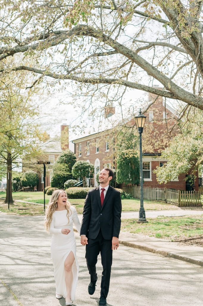 couple laughing walking down street