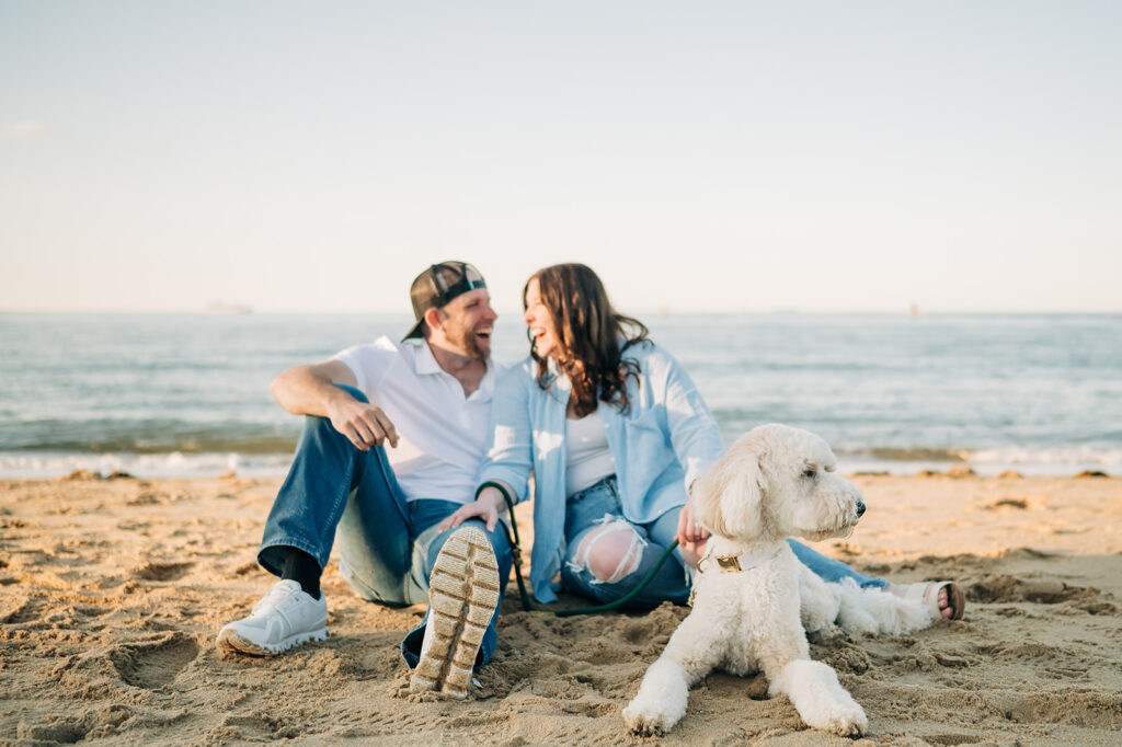 couple smiling on beach with doodle