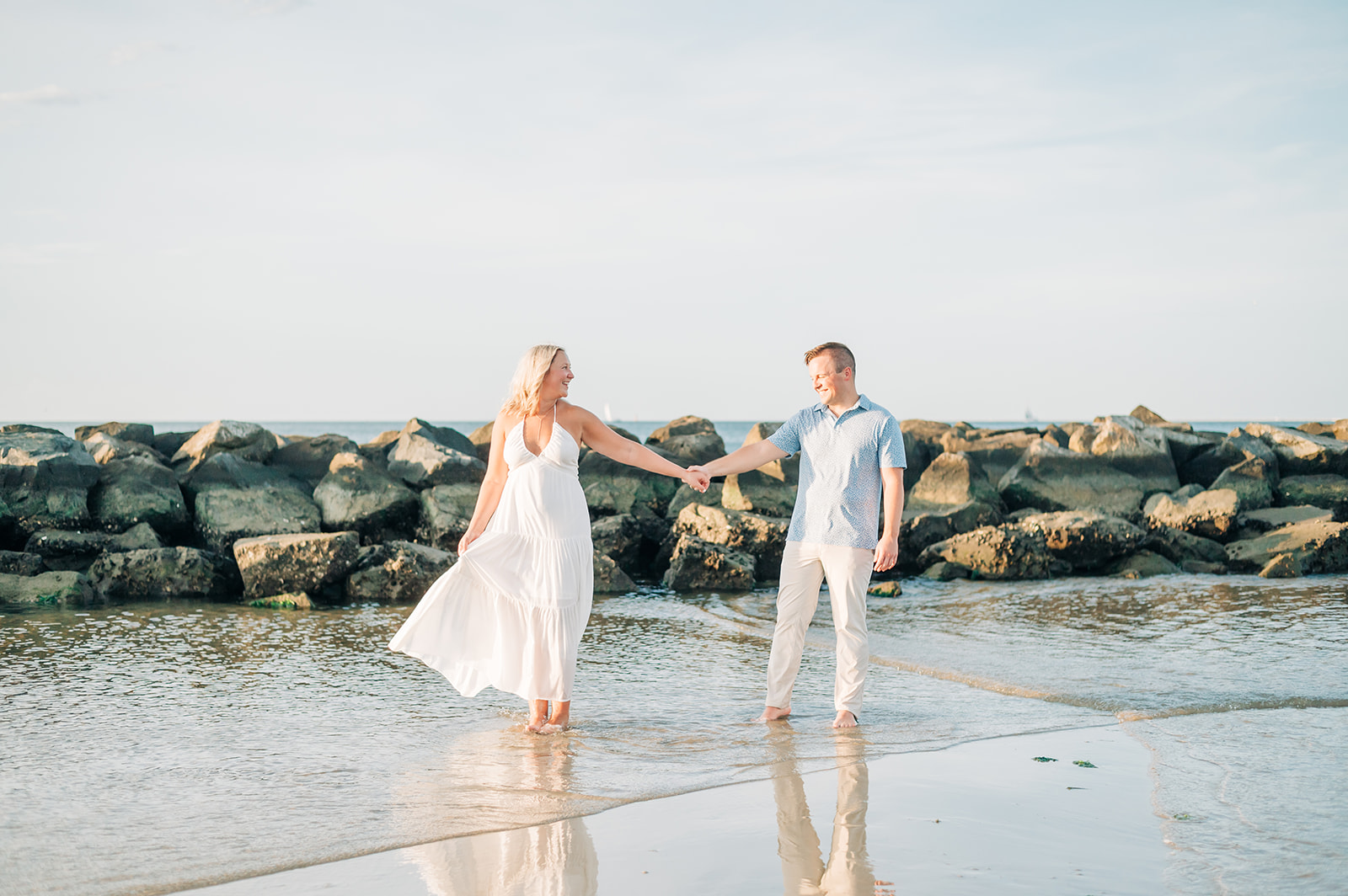couple laughing by the rocks