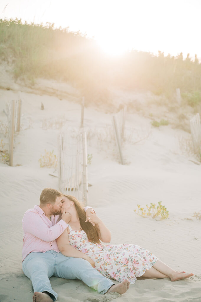 couple kisses on beach