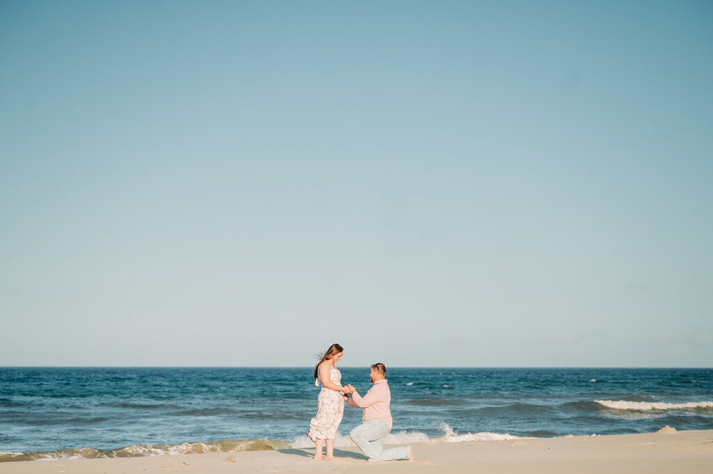 man proposes on beach