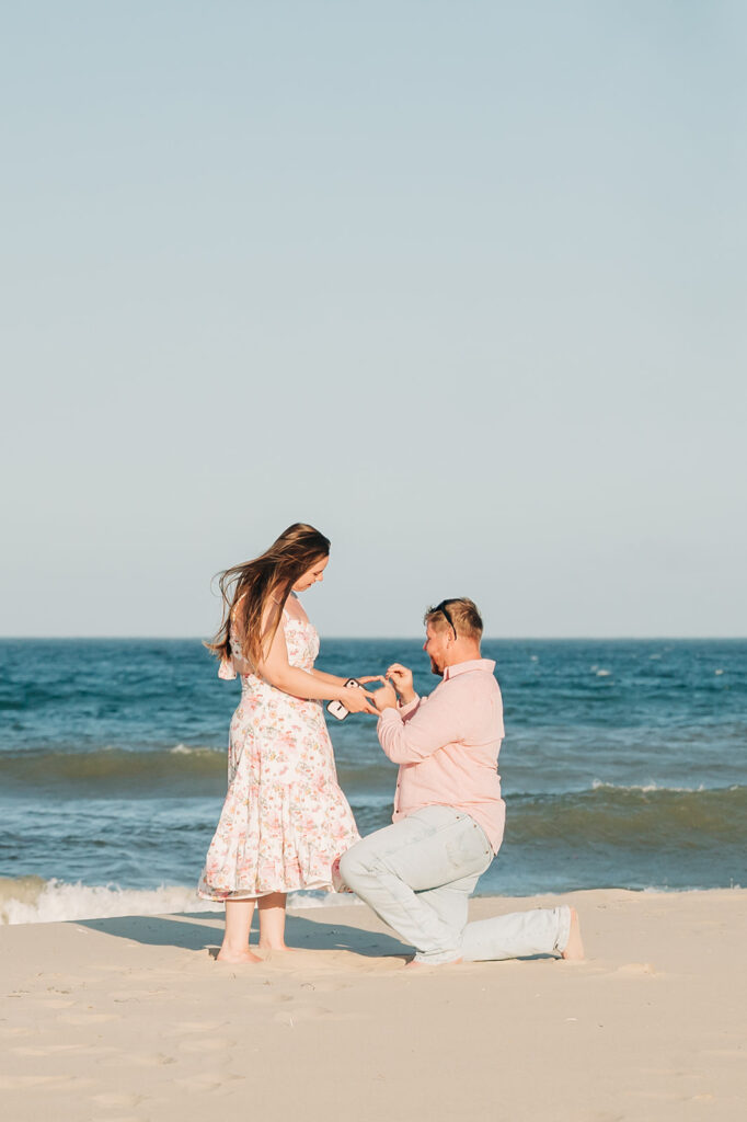 man proposes on beach