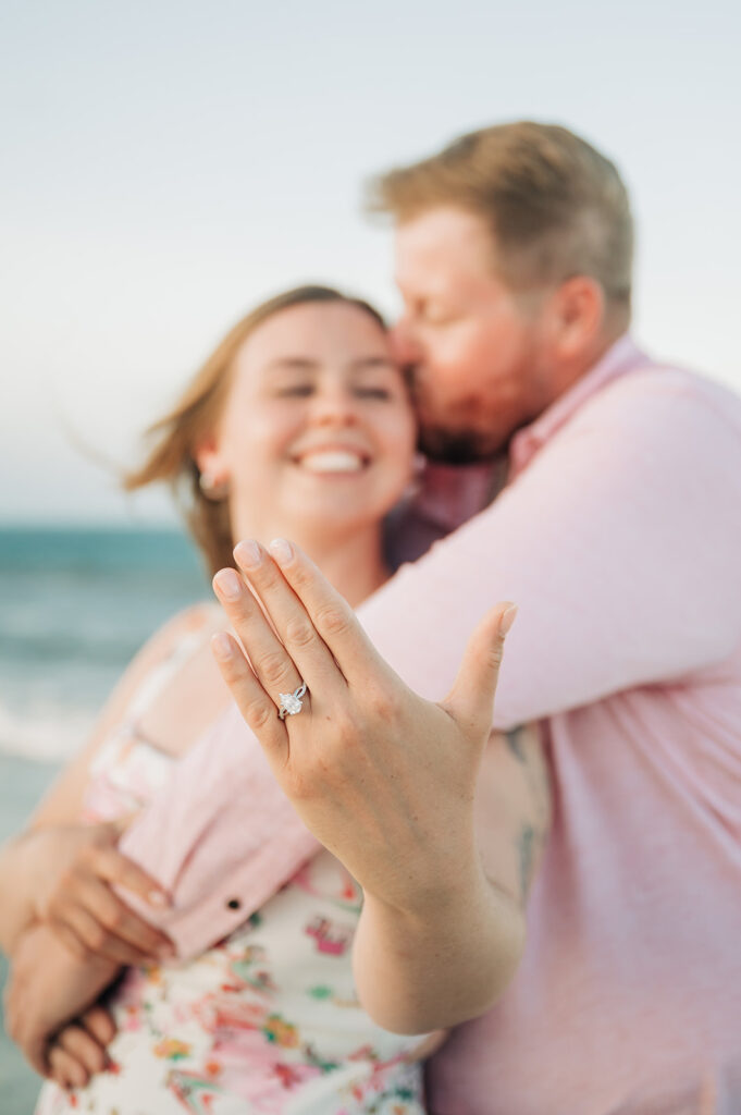 couple shows off ring