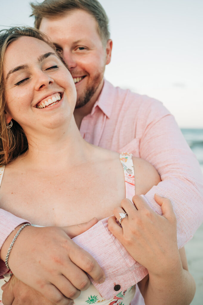 couple laughs after proposal