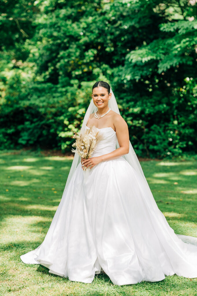 bride posing with florals