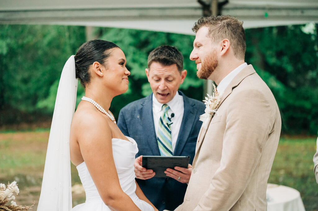 Couple smiling during ceremony