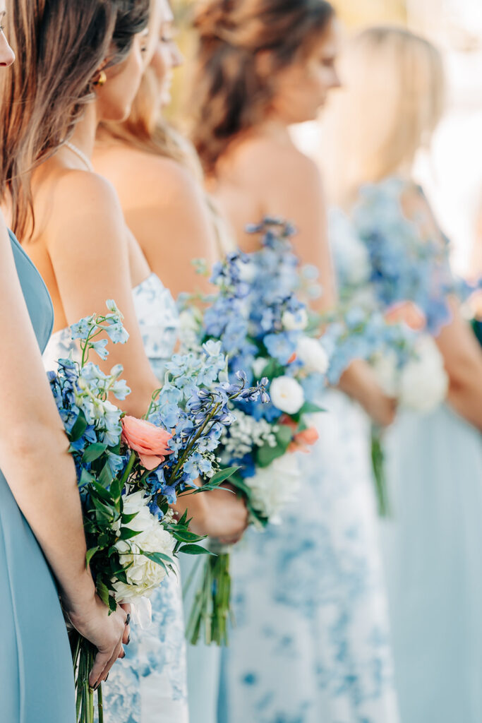 bridal party with blue flowers