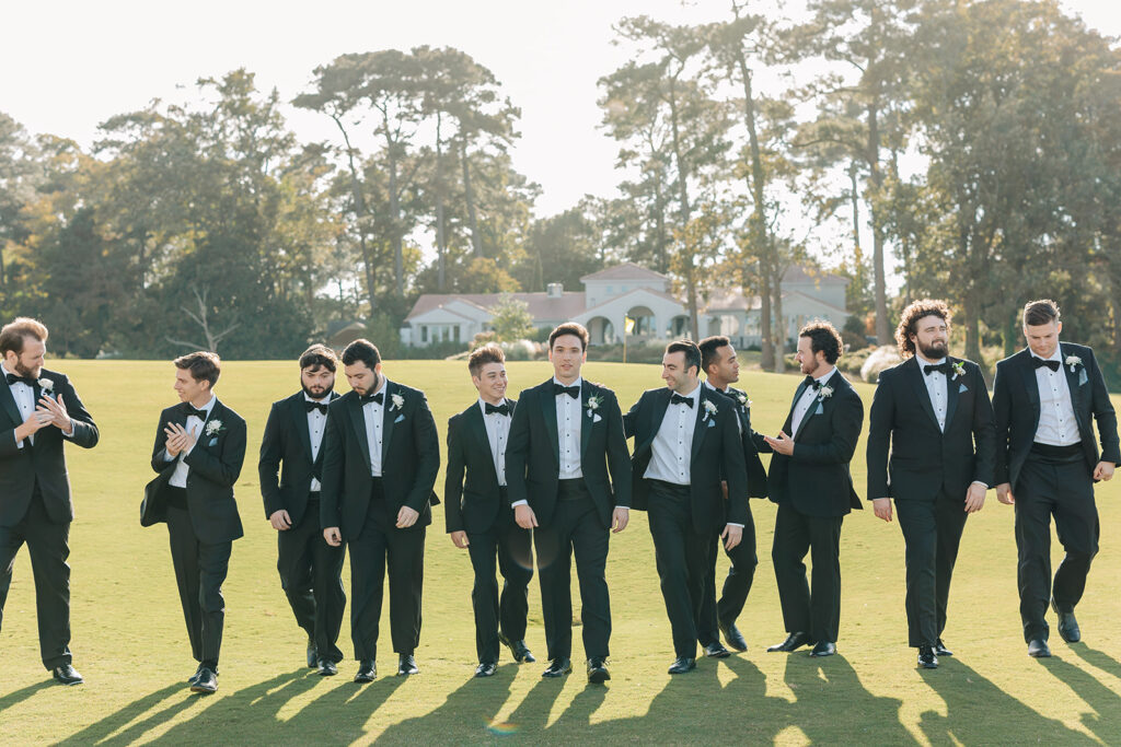 groom walking with groomsmen