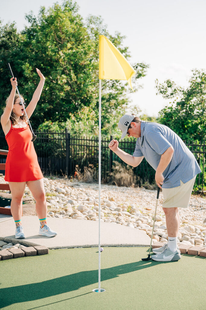 fun engagment portraits playing mini golf