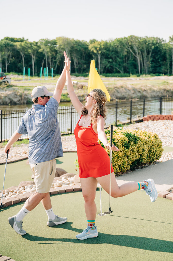 Fun mini golf engagement portraits