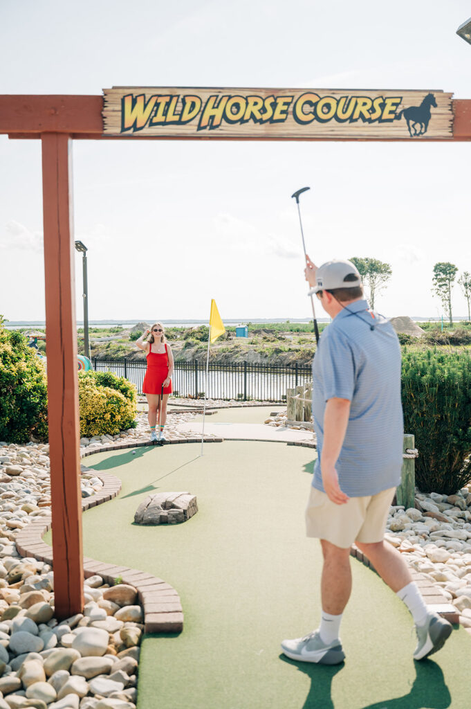 couple playing mini golf